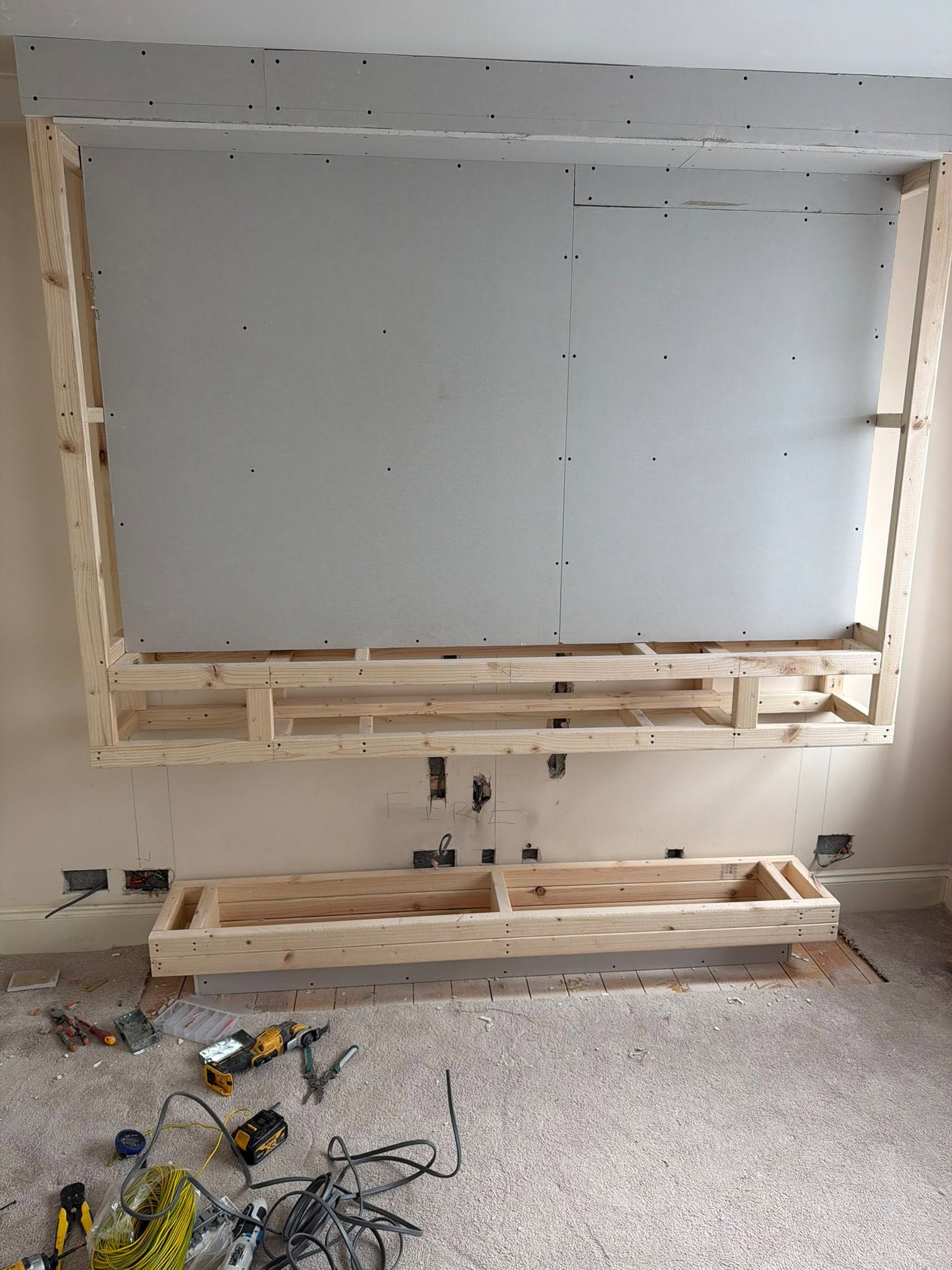 Electrical first-fix during media wall build