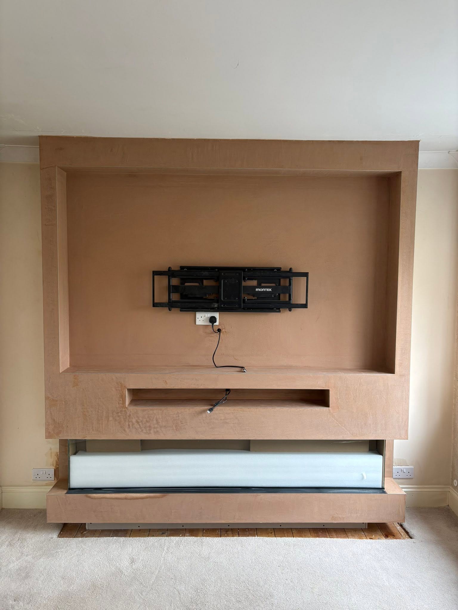 Plumbing and appliance rough-in during media wall build